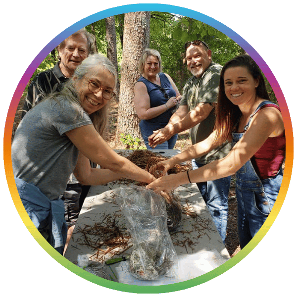 People learning how to grow mushrooms